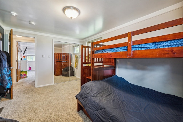 carpeted bedroom with a closet