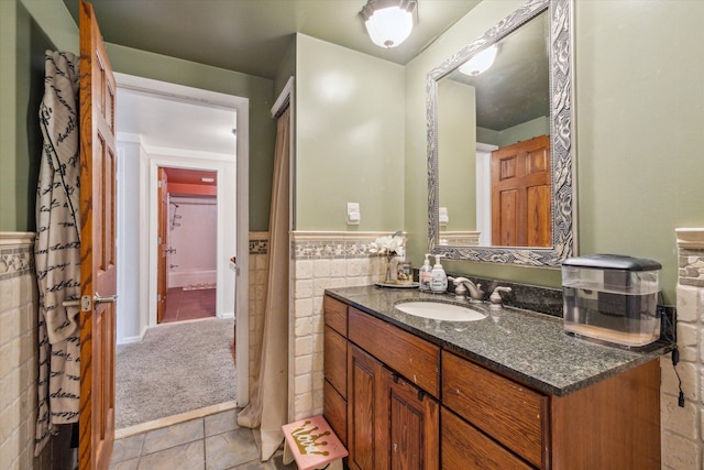 bathroom featuring tile patterned flooring and vanity