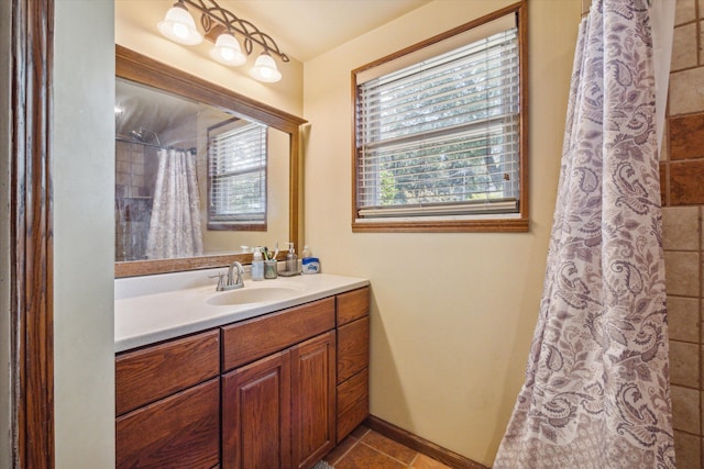 bathroom with tile patterned floors, curtained shower, and vanity