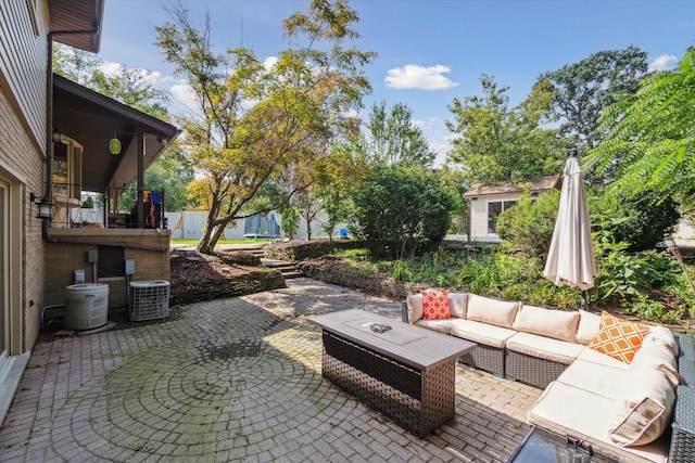 view of patio / terrace with cooling unit and an outdoor hangout area