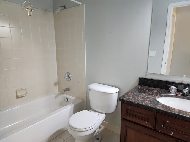 full bathroom with tile patterned flooring, vanity, toilet, and tiled shower / bath