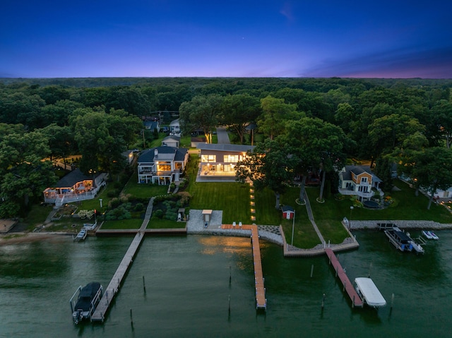 aerial view at dusk with a water view