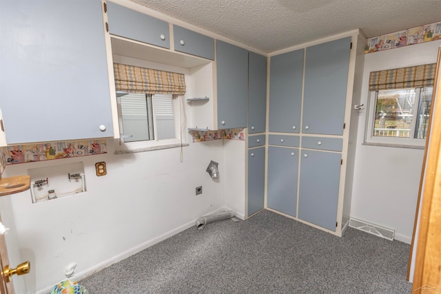 laundry room featuring washer hookup, cabinets, dark colored carpet, hookup for an electric dryer, and a textured ceiling