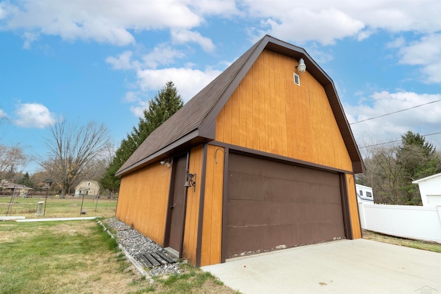 garage featuring a lawn