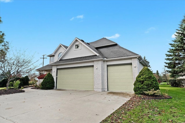 exterior space featuring a yard and a garage