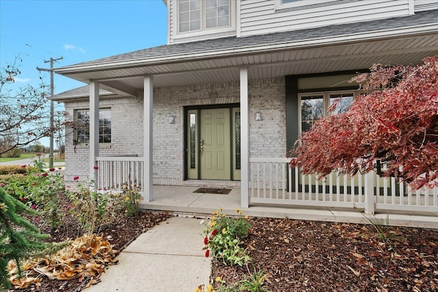 doorway to property featuring a porch