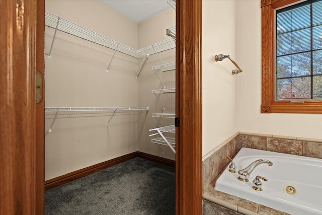 bathroom with tiled tub