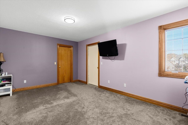 unfurnished bedroom featuring carpet flooring