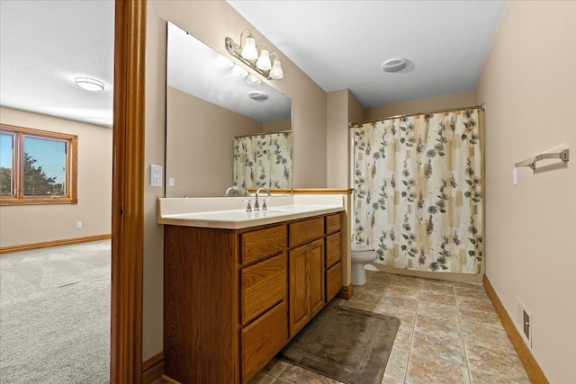 bathroom featuring vanity, a shower with shower curtain, and toilet