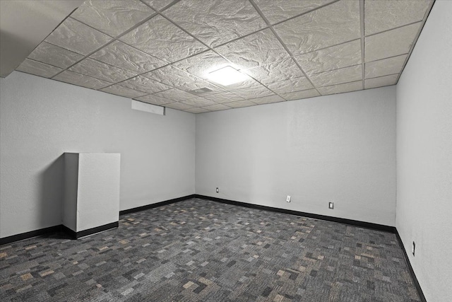 empty room featuring dark colored carpet