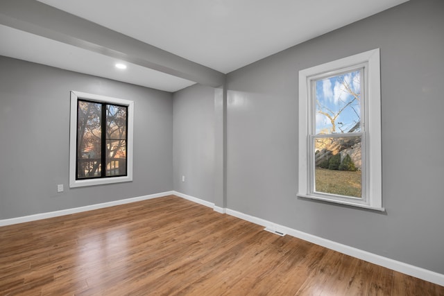 unfurnished room featuring wood-type flooring