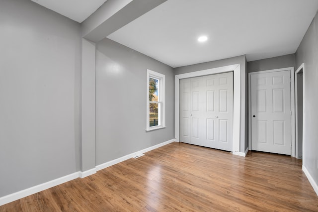 unfurnished bedroom featuring light hardwood / wood-style floors