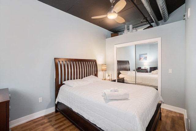 bedroom featuring dark hardwood / wood-style flooring, a closet, and ceiling fan