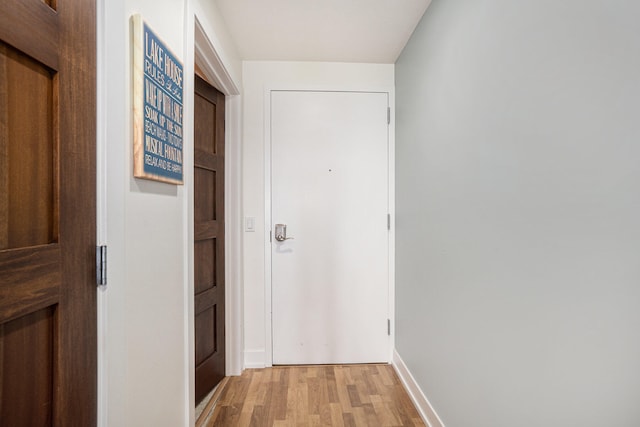 hall with light hardwood / wood-style flooring