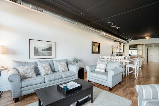 living room with wood-type flooring