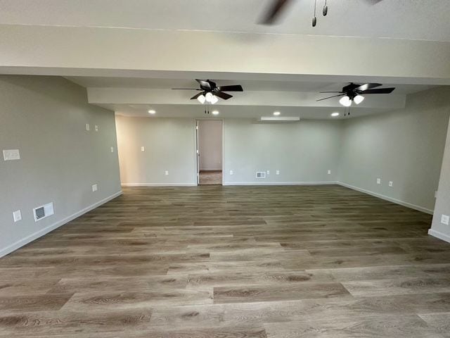 empty room with hardwood / wood-style flooring