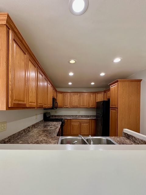 kitchen featuring sink and black appliances