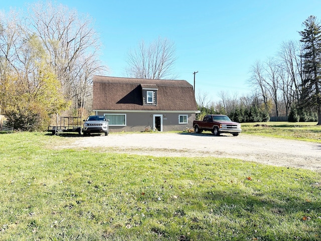 view of side of property featuring a yard