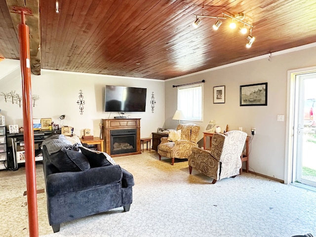 living room featuring crown molding, a fireplace, carpet floors, and wood ceiling