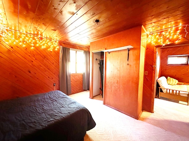 bedroom with wood walls, a closet, and wooden ceiling