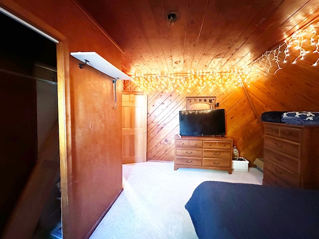 bedroom with wooden ceiling, wooden walls, and a closet