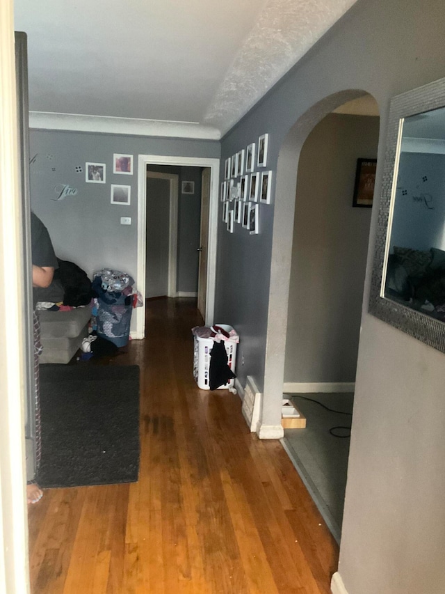 hallway with hardwood / wood-style flooring