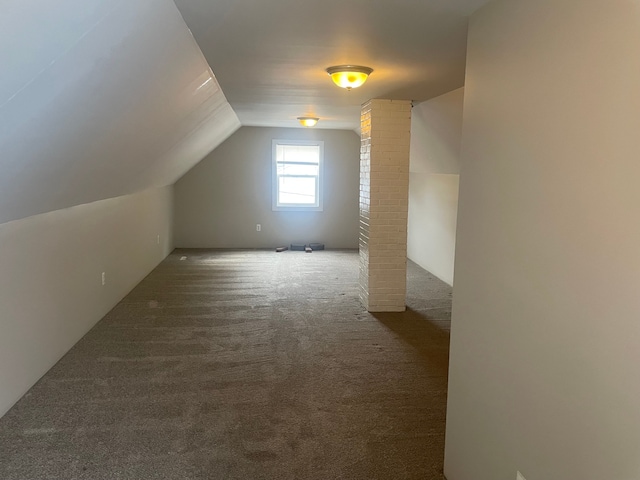 bonus room with carpet and vaulted ceiling