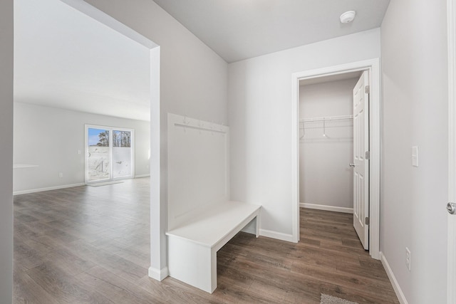 mudroom with wood finished floors and baseboards