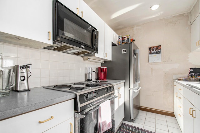 kitchen featuring light tile patterned flooring, tasteful backsplash, white cabinetry, and electric stove