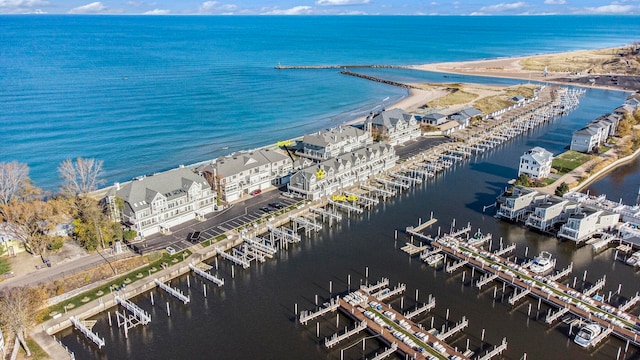 aerial view featuring a view of the beach and a water view