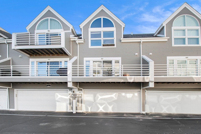 exterior space featuring a balcony and a garage