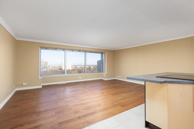 interior space featuring hardwood / wood-style flooring and crown molding