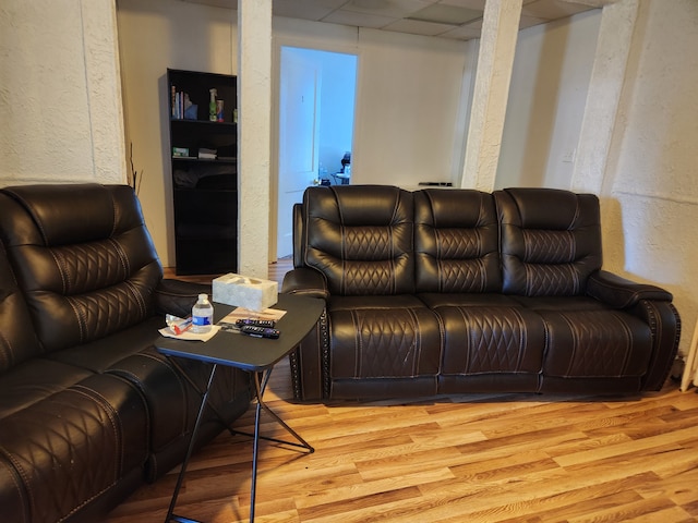 110 Whittemore St, Pontiac, MI 48342 - living room with light wood finished floors, a textured wall, and a paneled ceiling