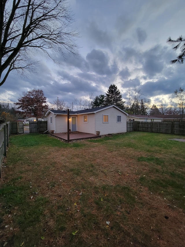 rear view of property with a lawn