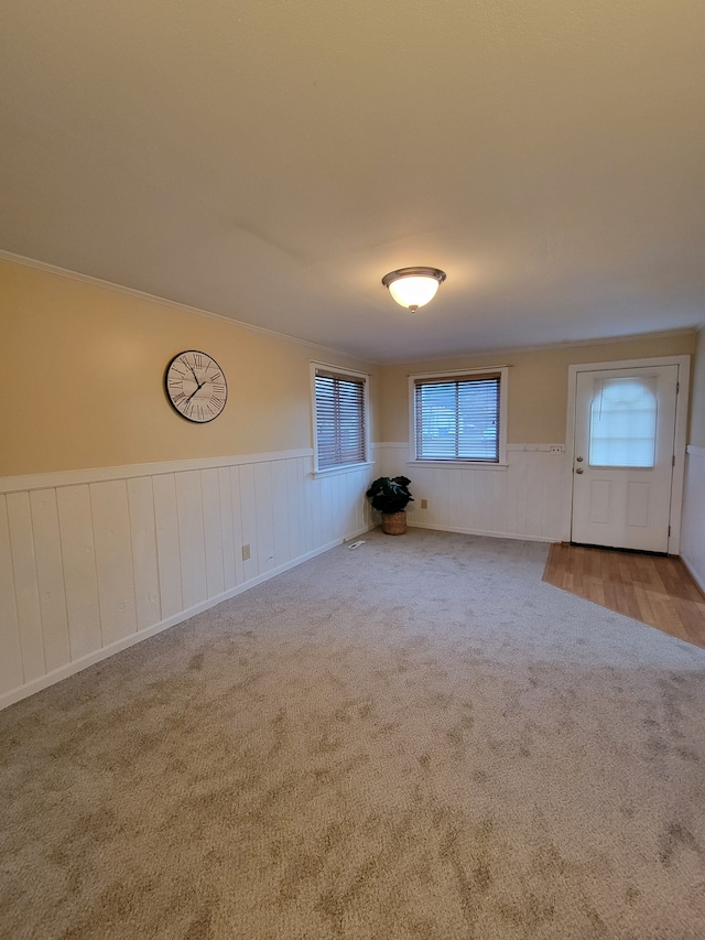 interior space featuring light carpet