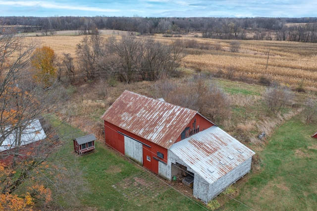 birds eye view of property with a rural view