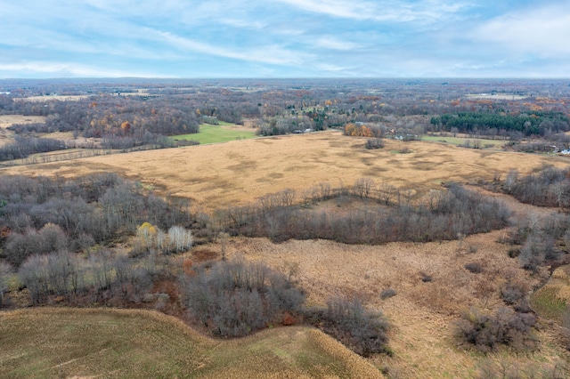 birds eye view of property with a rural view