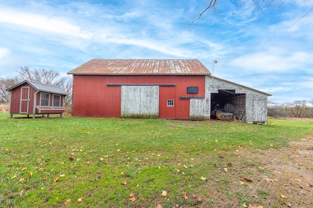 view of outbuilding with a lawn