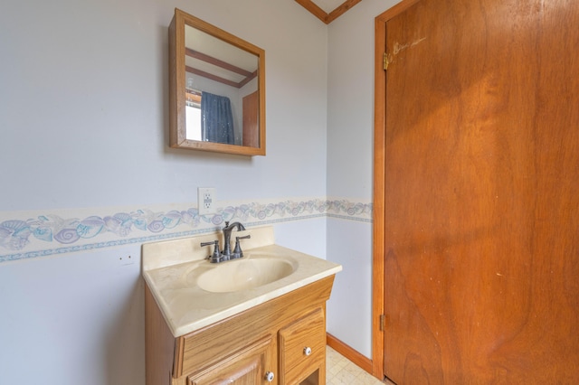 bathroom featuring vanity and ornamental molding