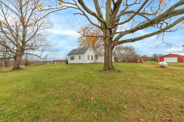 view of yard featuring an outbuilding and a garage