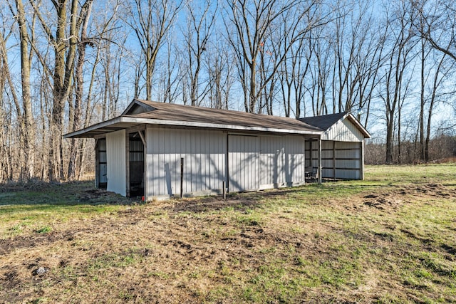 garage featuring a yard