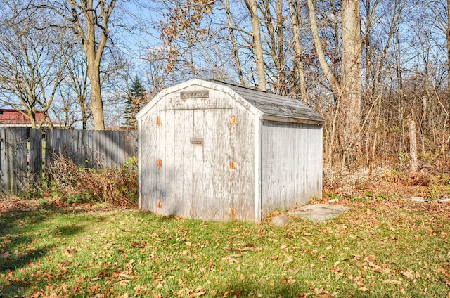 view of outbuilding featuring a yard