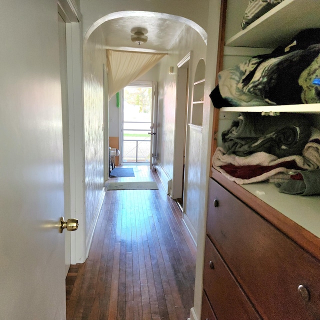 hallway featuring dark wood-type flooring