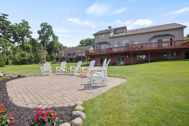 view of yard with a patio and a wooden deck