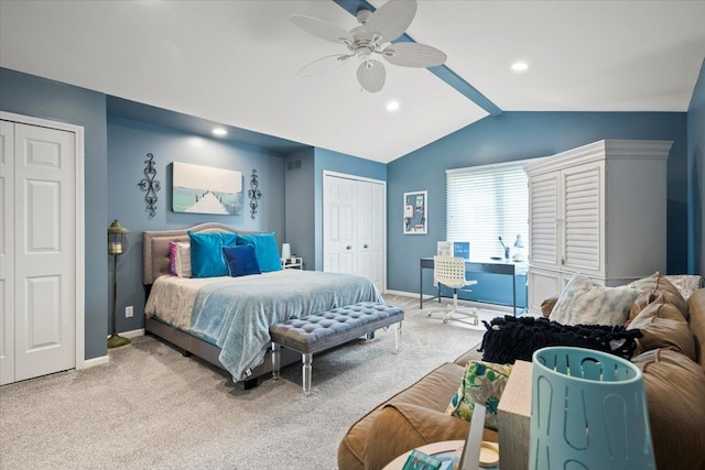 carpeted bedroom featuring ceiling fan and vaulted ceiling