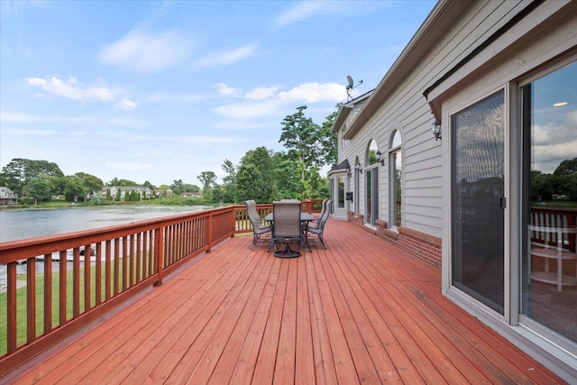 wooden terrace featuring a water view