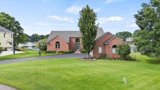 view of property with a water view and a front yard