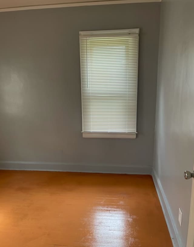 unfurnished room featuring hardwood / wood-style floors