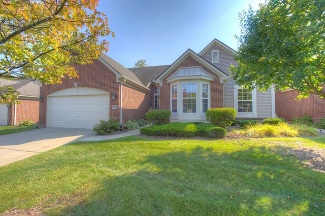 view of front facade with a garage and a front lawn