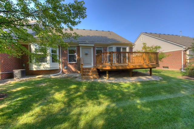 rear view of house with a yard, a deck, and central AC unit